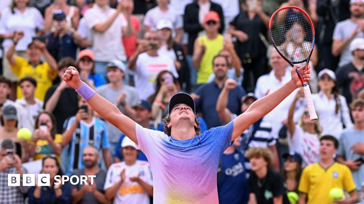 Joao Fonseca celebrates after beating France's Pierre-Hugues Herbert